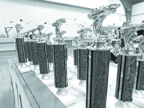 Race Time at the Pinewood Derby Coveted trophys for the winners in numerous categories.