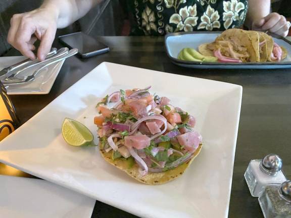 Tuna Crudo Ceviche Tostada (center) and Cochinita Tacos