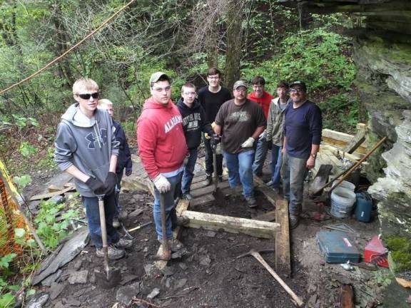 A safe walk in the woods, thanks to aspiring Eagle Scout Volunteers pause for a photo as they work on the steps (Photo by George Leroy Hunter)