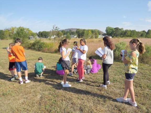 An inspirational nature hike Students are observing and writing about nature