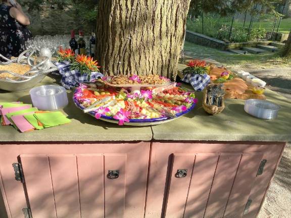 Buffet on table built around tree