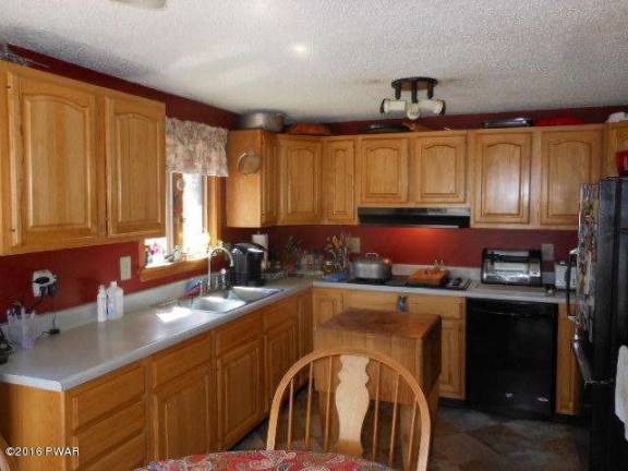 Secluded home has acreage, pool, stream, privacy Secluded home has acreage, pool, stream, privacy