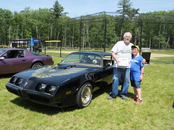 The cars are the stars at 'Cruise in the Park' Rick Staskowski and his son Eric of Hawley pose next to their 1979 Pontiac Trans Am