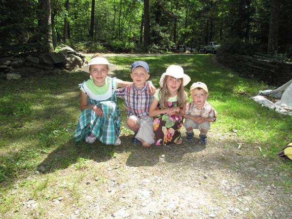 All creatures great and small 4 of the 5 Meler children. (from left to right) 11 yr old Marcelins, 5 yr. old Stefan, 7 yr. old Kaye,and 2 yr. old Frank