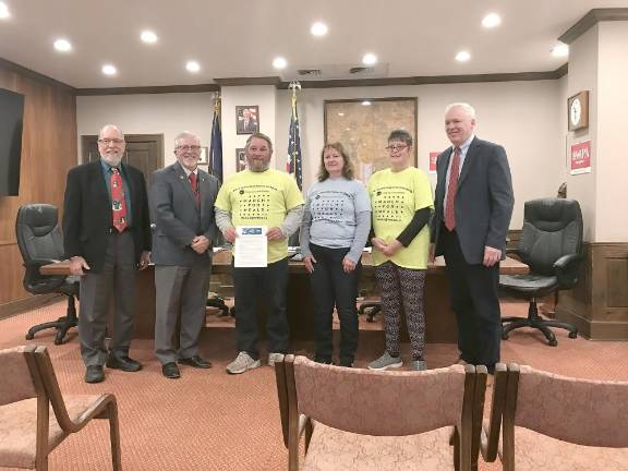 Announcing the Subaru Share the Love contribution offer were, left to right, Commissioner Tony Waldron, Commissioner Matthew M. Osterberg, Bob Skibber, Cherie Bland, Joan Edel, and Commissioner Ronald R. Schmalzle