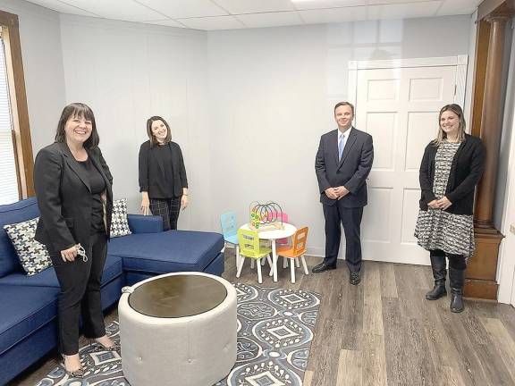 Reception room of The Dickson House, from left: Sarah Wilson, Director of CAC Services; Molly Carson, MDIT Coordinator/Forensic Interviewer; District Attorney Ray Tonkin; and Sara Loeb, Special Victim Interviewer (Photo provided by Sarah Wilson)