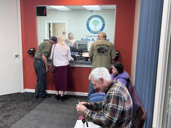 The new DMV gets its first customers.