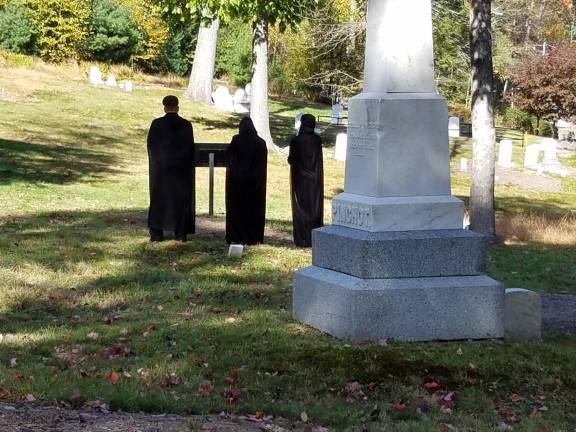 Readers posed at cemetery headstones during the 2018 program.