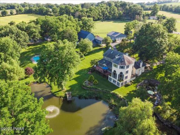Stone farmhouse on 29+ acres with pond, pool, stables and more
