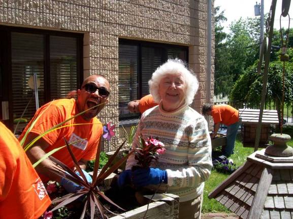Home Depot volunteers lend a hand to Belle Reve Senior Living Photo provided A volunteer from Home Depot with Belle Reve resident Priscilla Roth.
