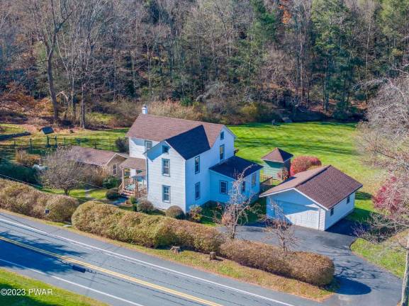 Brook-front farmhouse has lots of character