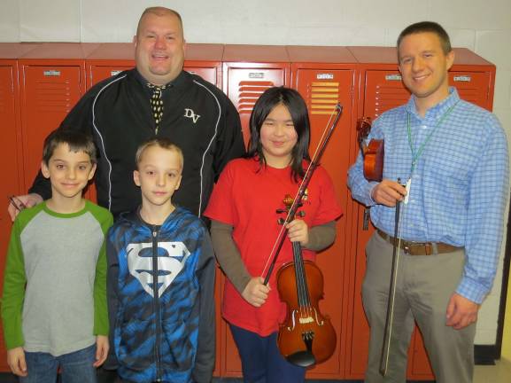 Top kids for January Orchestra Students of the Month: Henry Goginsky, Jack Goginsky and Ellen Duan.