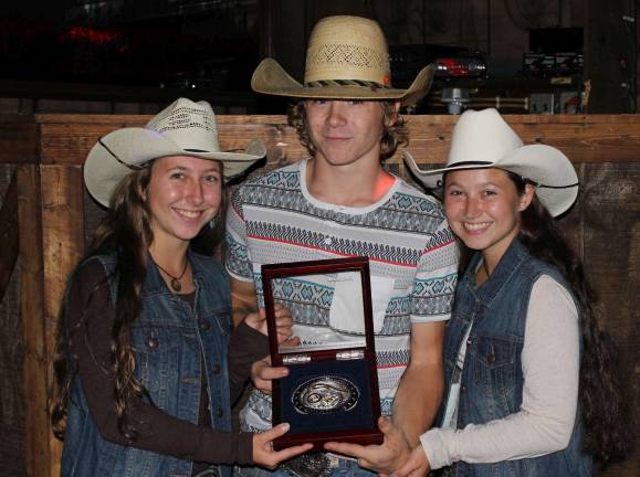 Malibu Ranch celebrates rodeo champs Bull riding champion Grayson Cole of Schuylkill Haven is presented with his winning Malibu Dude Ranch 2017 bull rider buckle by sisters Victoria (left) and Priscilla Detweiler, daughters of ranch owners Dr. Allan and Phyllis Detweiler (Photo provided)