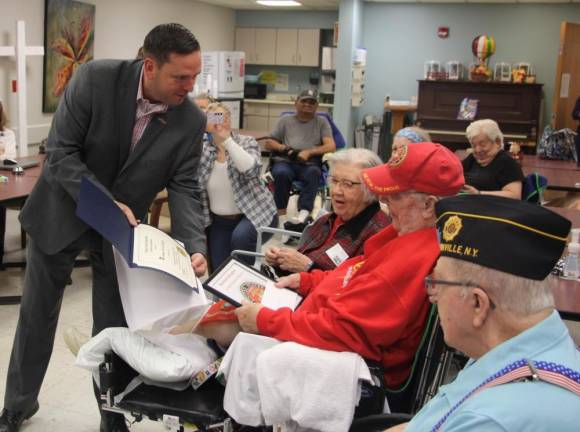 County Executive Neuhaus presents a certificate of recognition to Norman Gallagher at St. Josephs Place at Bon Secours Community Hospital in Port Jervis.Gallagher is a U.S. Marine Corps veteran.