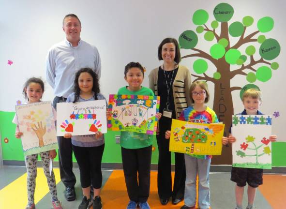 'Growing Acceptance' poster contest winners announced The winners with their artwork (Photo by Peg Snure)