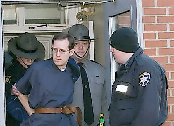 Eric Frein is escorted out of the Pike County Courthouse in Milford in 2015 (Photo by Jeff Sidle)