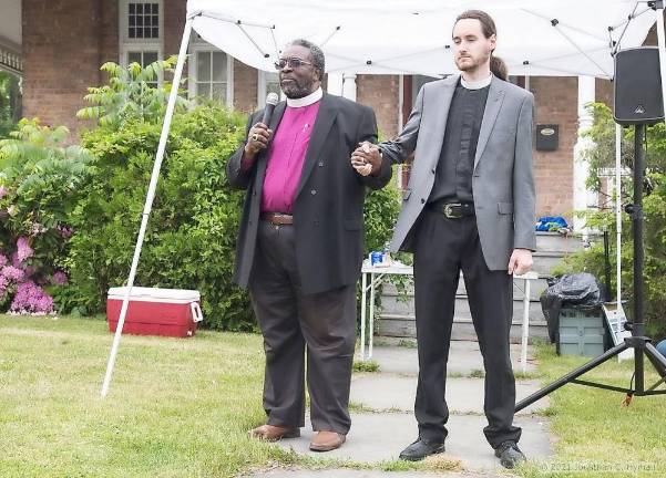 Bishop James Rollins, Sr., of Tabernacle Church in Middletown, left, and Father Jean Pierre Sequin