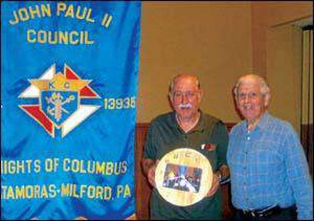 Honoring a former grand knight Honoring a former grand knight