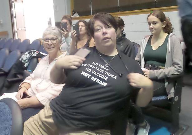 Blennie Kelly shows the tee-shirt she designed (Photo by Frances Ruth Harris)