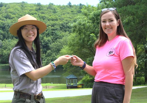 Water Safety Challenge Coins awarded Visual Information Specialist Jasmine Leung presenting Alex Wrona with the Upper Delaware Water Safety Challenge Coin.