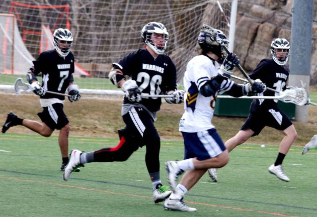 Delaware Valley lacrosse team loses to Vernon Vernon Viking Dylan Scheidle carries the ball while shadowed by a convoy of Delaware Valley Warriors.