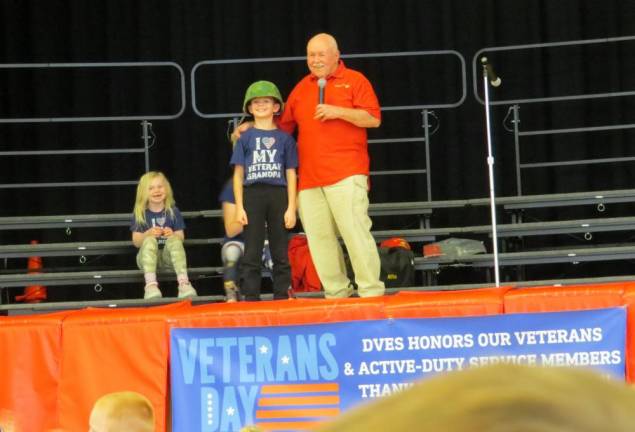 The grandchildren of Sergeant Gary Williams help show off the equipment he used.