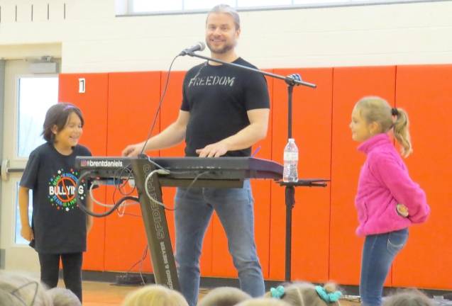Producer and composer teaches kids about more than music From left: Eliana Alvarez, Brent Daniels, and Jordan Zielinkski