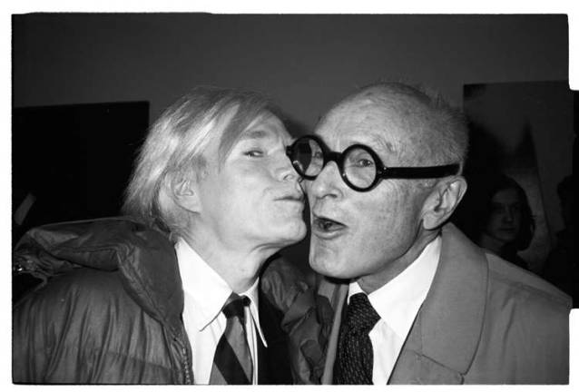 Public invited to unveiling of 10 new Christopher Makos photographs Andy Warhol kissing Philip Johnson, 1979, by Christopher Makos