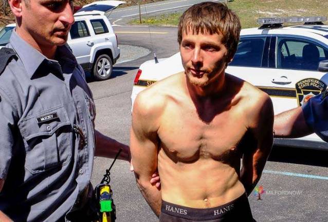 Sky Michael McDonough being led into the Pennsylvania State Police barracks at Blooming Grove in April 2016, after he escaped from the police and recaptured at the llama farm in Milford where Leanna Walker's body was discovered weeks later. (Photo by Preston Ehrler)