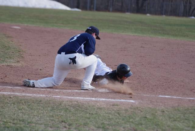 Delaware Valley Warriors suffer season opener loss in baseball and softball A Delaware Valley runner returns to first base before the tag during a pick-off attempt by Abington Heights.