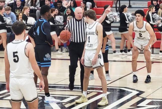 Delaware Valley’s Jake Brower (#1) prepares to jump for the ball as teammates Jackson Corrie (#5) and Tyee Irving (#2) look on during a game against Wilkes-Barre on Feb. 23, 2023 in Milford.