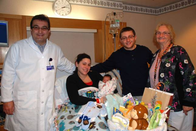 From left: Mehran Langroudi, MD, Women&#x2019;s Health Center; parents Adriana and Joseph with baby Dominic: and Mary Lou Eimers, RN. (Photo provided)