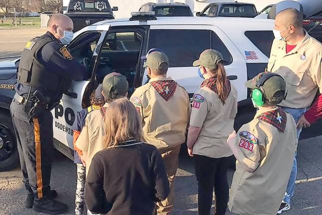 Cub Scout Pack 298 meets with Ogdensburg police chief Chief Gordon shows Scouts the different components of a police car (Photo provided)