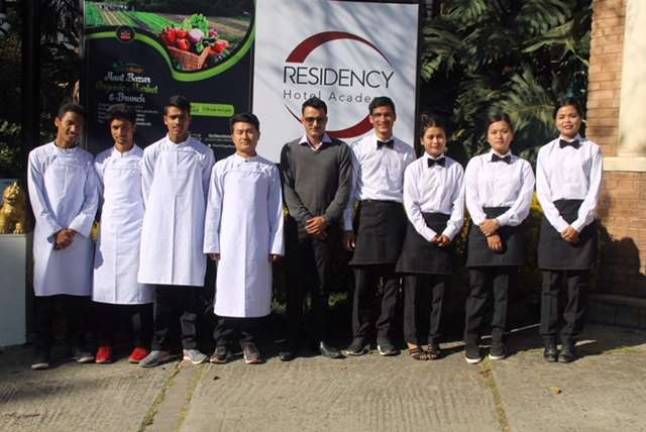 Madan Khanal (center) and the apprentices from the Nepal Orphan&#x2019;s Home at the Residency Hotel Academy (Photo provided)