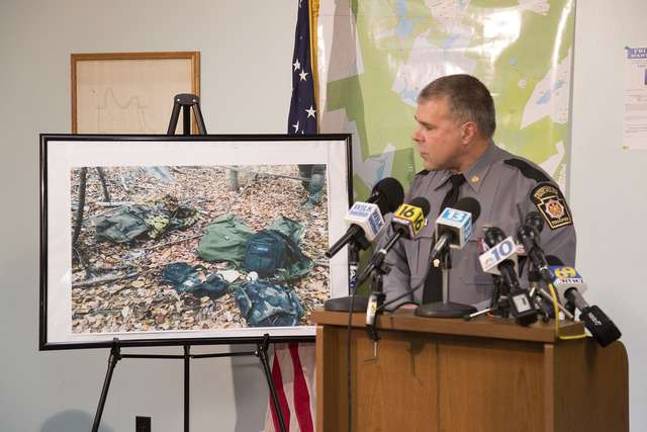 Man hunt continues Lt. Col. George Bivens of the Pennsylvania State Police gives a press conference update on the Eric Frein search held at the Blooming Grove Twp Hall at 3 p.m. Friday. Lt Col Bivens displayed an enlarged photo taken by the state police of green backpacks that were located this past Tuesday in the heavily wooded search area near Freins parents home. The backpacks did contain ammunition. Bivens also stated that Frein was eating cans of tuna fish and Ramen Noodles.
