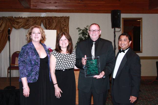Tri-State Chamber of Commerce honors businesses Community Spirit Award: CruzinPort, Harold and Sheri Butler (from left): Charlene Trotter-Chamber Executive Director, Sheri Butler, Harold Butler, Amador Laput, Chamber President 2015