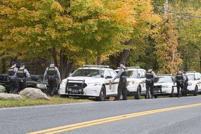 Man hunt continues Photos by Robert G. Breese One of the many contingents of Pennsylvania State Police near the Eric Frein search area on Thursday afternoon October 10, 2014