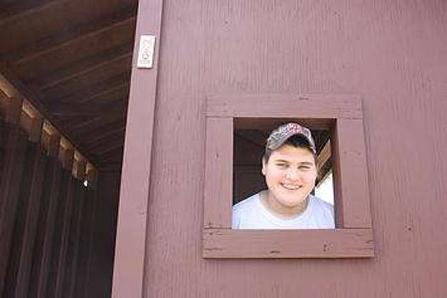 Eagle Scout project casts an eye on eagles Joseph P. Loughney III peers outside the improved eagle-viewing station at Shohola Marsh Reservoir (Photo provided by Shohola Boy Scout Troop 76)