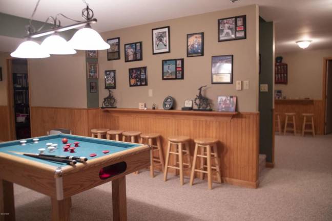 Upscale center hall colonial offers space and privacy Rec room
