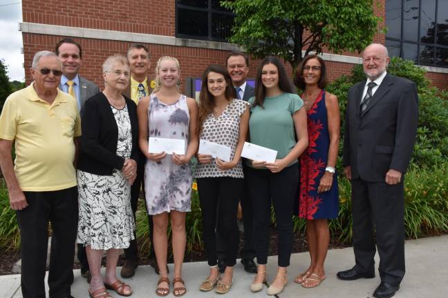 Front row (from left): parents of the late Cathy Collins, Bill and Mary Theobald; Paige Barillo, Cathy Collins Scholarship recipient; Hannah Smith; Isabella Calabrese, Dr. Howard R. and Marian C. Patton Scholarship recipients. Back row: Charles Curtin, Honesdale National Bank; Jamie Collins, husband of the late Cathy Collins; David Hoff, CEO, Wayne Memorial Hospital; Penny Gustin Friese and Jack Dennis, executive director, Wayne Memorial Health Foundation. Missing from photo is Ashley Davis, Dr. Howard R. and Marian C. Patton Scholarship recipient.