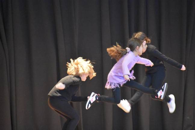 Lip sync packed with class acts Second grader Daphne Hernandez and her trio get up.