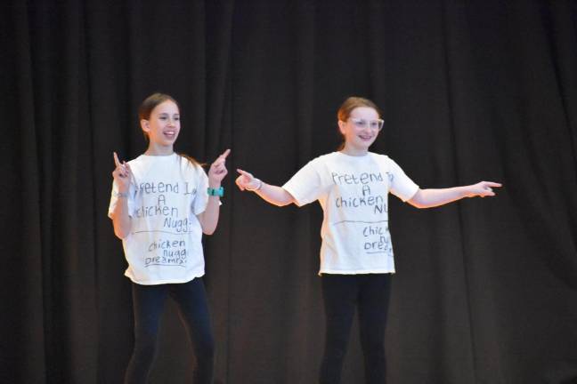 Fifth graders Jodie Harrison and Clara Clark with crowd pleaser “Chicken Nugget Dreamland.”