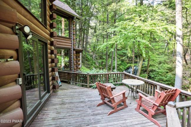 This custom log home is surrounded by nature