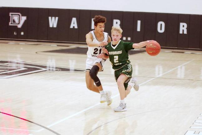 Wyoming Area's Evan Melberger handles the ball in the first half while covered by Delaware Valley's Noah Newton.