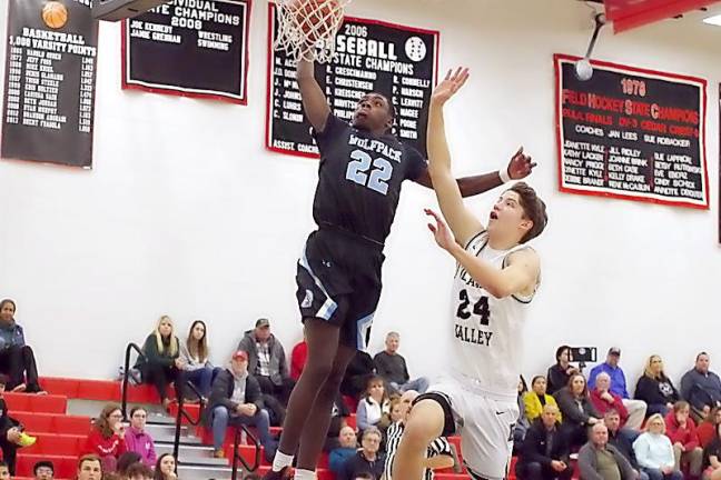 Wilkes-Barre's Brandon Hall is about to dunk the ball while covered by Delaware Valley's Jackson Shafer in the first quarter. Hall scored 20 points.