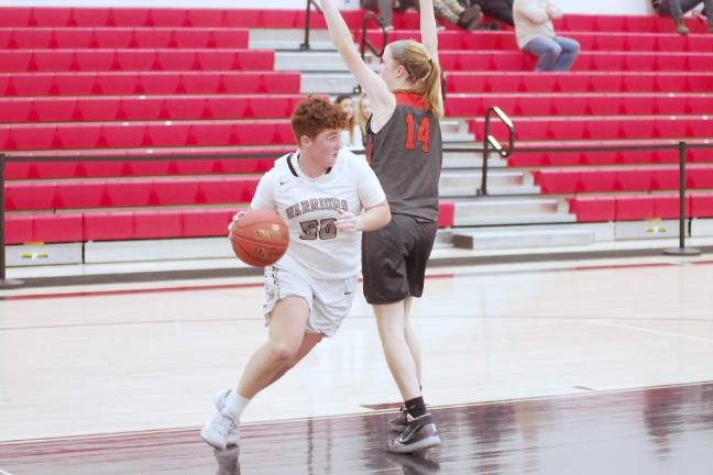 Delaware Valley's Kaitlyn Hernandez maneuvers the ball past a Tunkhannock defender in the fourth quarter. Hernandez scored 2 points.