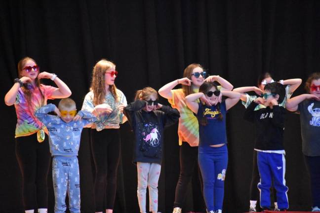 Performing Snoop Dogg’s “The Affirmations Song,” front row from left: Colin Wilson, Autumn Breen, Leah Luttke, Zay’ Vien Gonzalez, Savannah Kunis. Back row from left: Fifth graders Maddie Latini, Hazel Pope and Gia Cosentino joined the younger kids.