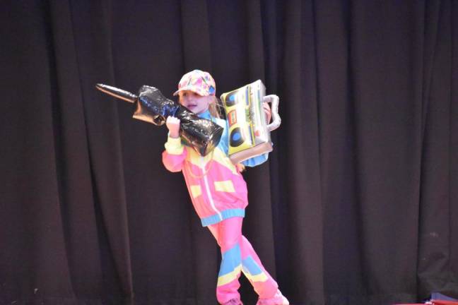 Lip sync packed with class acts Second grader Harper Holdridge performing “Ice Ice Baby.”