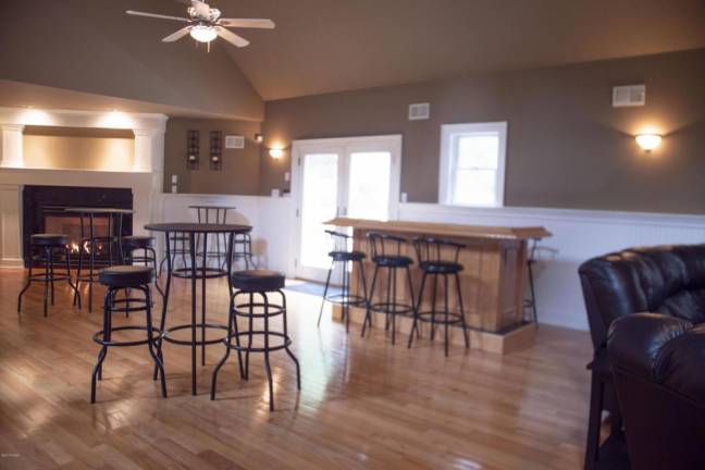 Upscale center hall colonial offers space and privacy Family room