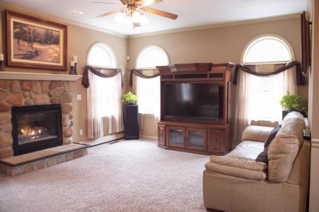 Upscale center hall colonial offers space and privacy Living room